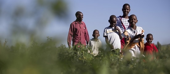 Joseph Kiplagat and his family in a French bean field