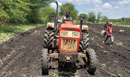 Mr Tarmo ploughing a field on his tractor