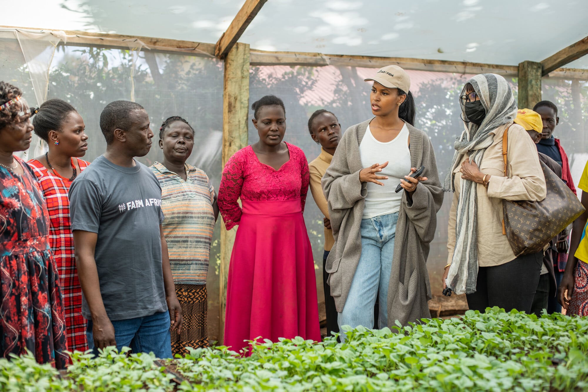 Sabrina Elba (M) and her mother, Maryam Egal (R), talk to Farm Africa’s Stephen Muguna (L), during a tour of a nursery in Bodeni, Saboti County in Western Kenya.