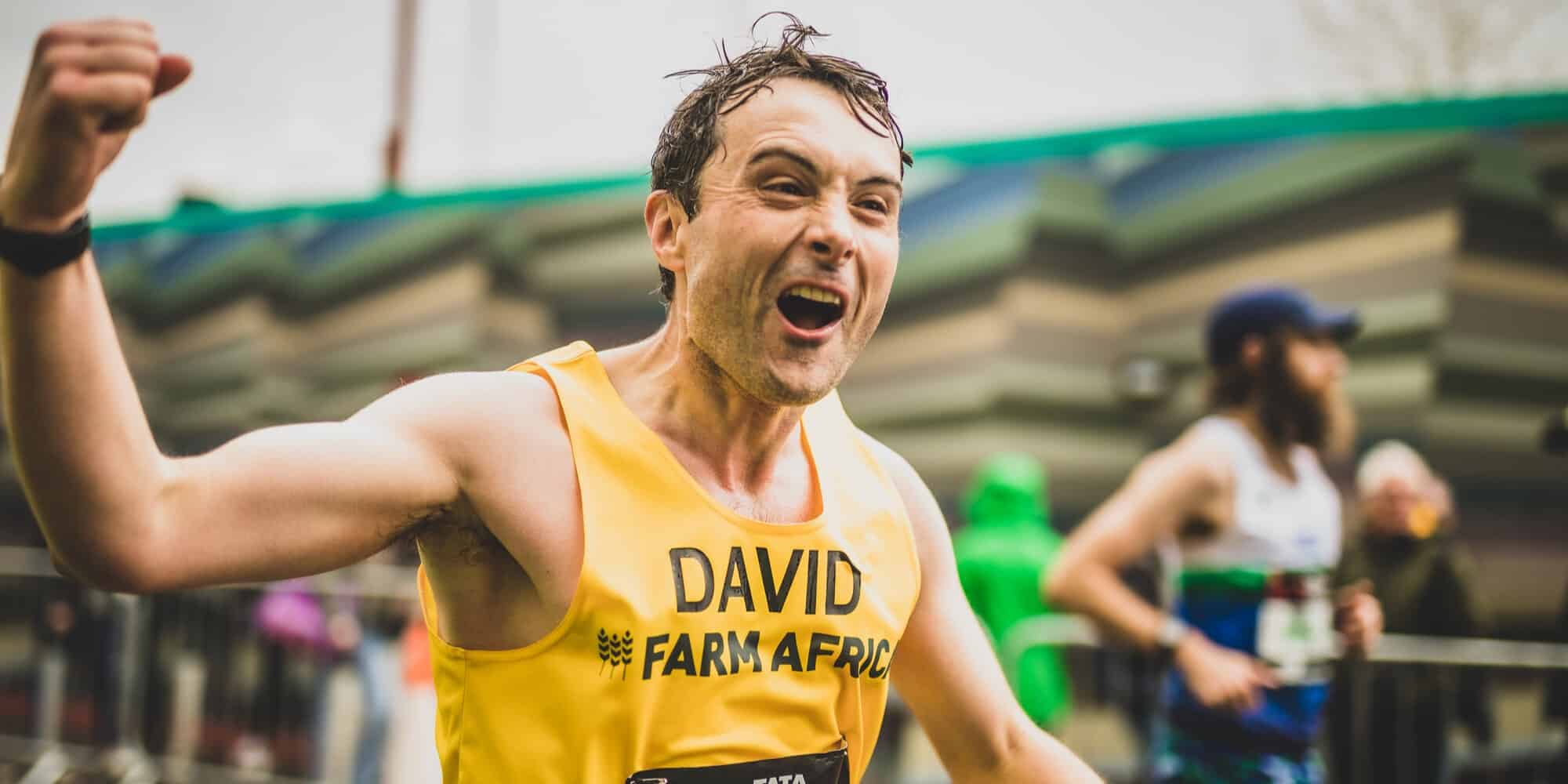 David Fouracre passing the Farm Africa cheer point at the London Marathon 2023. David ran as part of Team NFU.