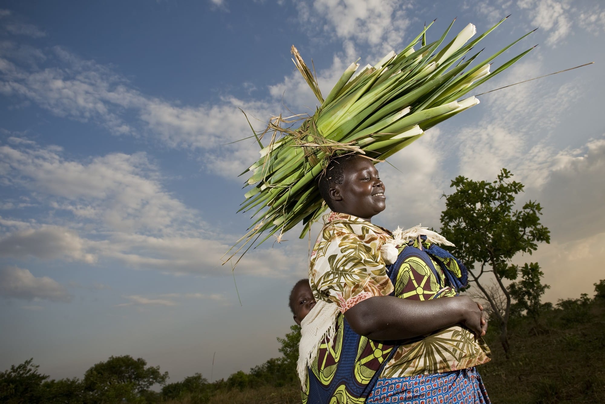 A woman carrying sisal on her head in Uganda.